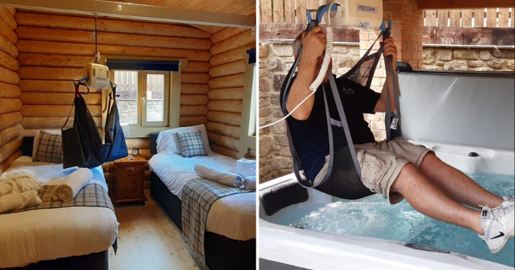 View of a bedroom at Vindomora Country Lodges with a hoist above the bed and a man using the hoist to gain access to the hot tub.